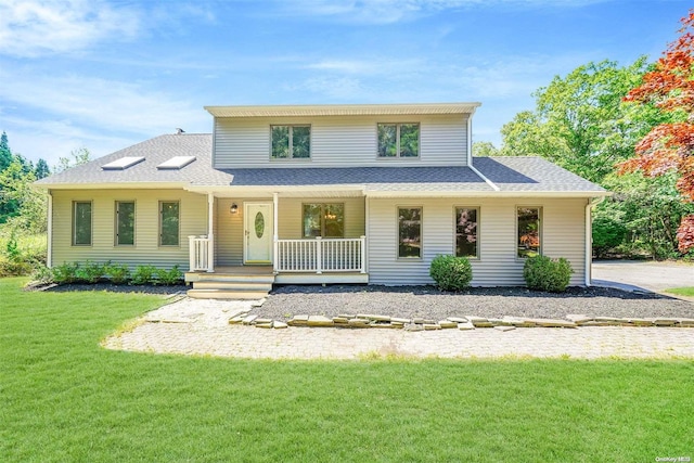 view of front of property featuring a porch and a front lawn