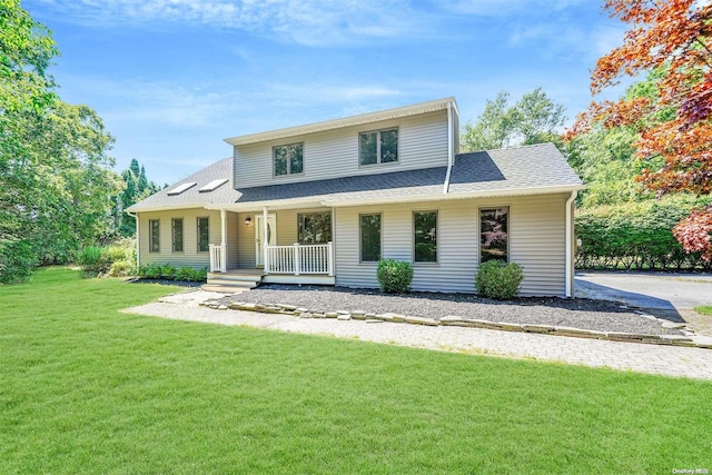 view of front of house featuring a front yard and covered porch