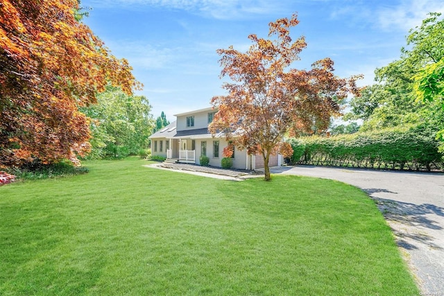 view of front of home featuring a porch and a front yard