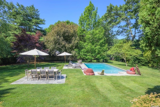 view of pool featuring a patio area and a yard