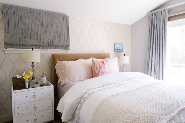 bedroom featuring lofted ceiling