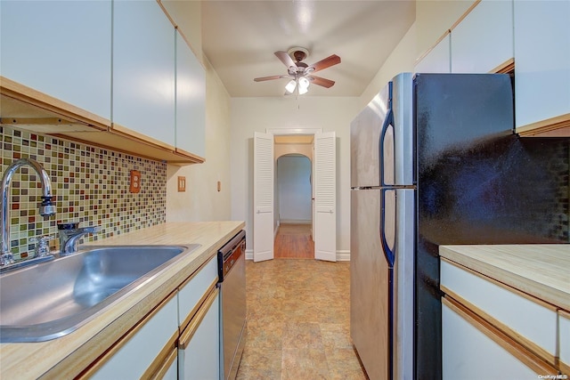 kitchen with dishwasher, tasteful backsplash, white cabinetry, and sink