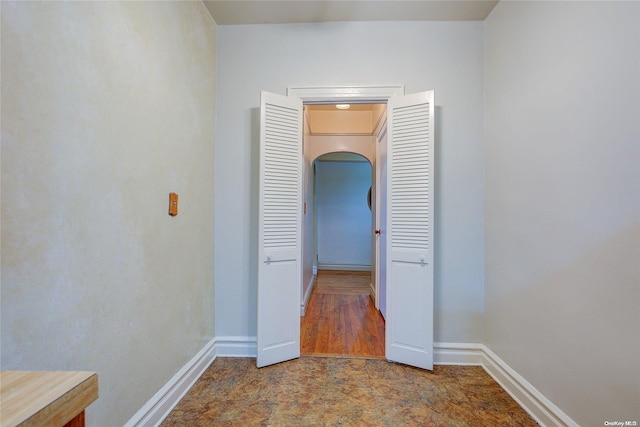 corridor featuring hardwood / wood-style floors