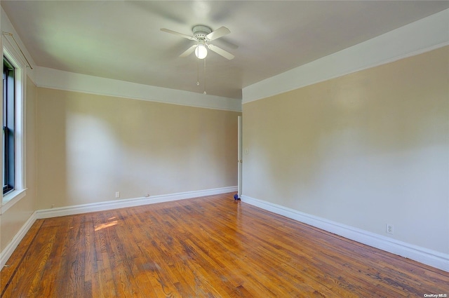 unfurnished room with ceiling fan and wood-type flooring