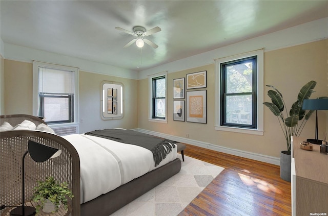 bedroom featuring light wood-type flooring and ceiling fan