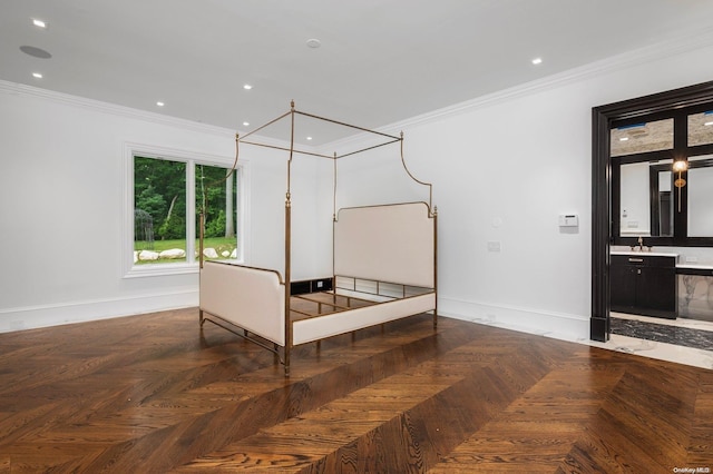 bedroom with ensuite bathroom, crown molding, parquet floors, and sink