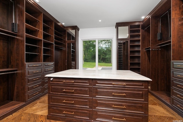 spacious closet featuring light parquet floors