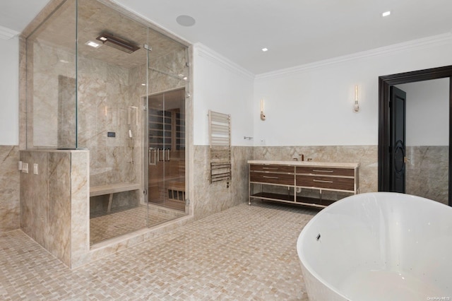 bathroom featuring vanity, crown molding, tile walls, and plus walk in shower