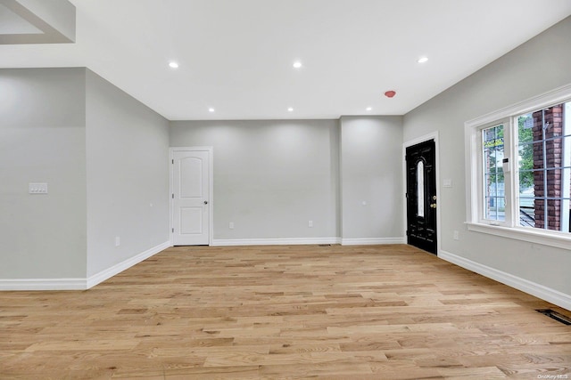 spare room featuring light wood-type flooring