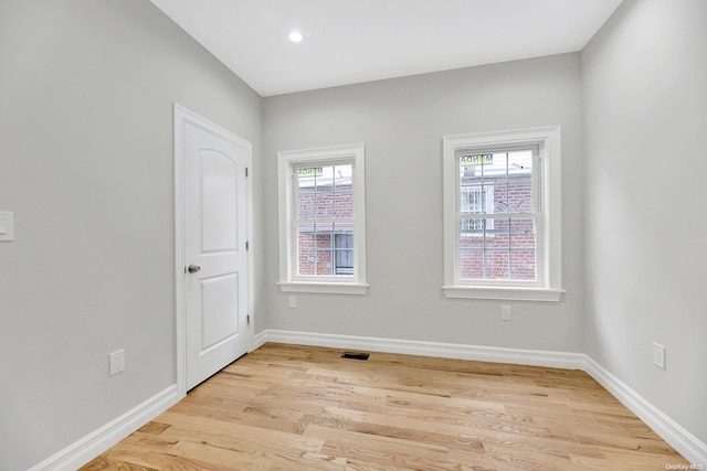 spare room with light wood-type flooring