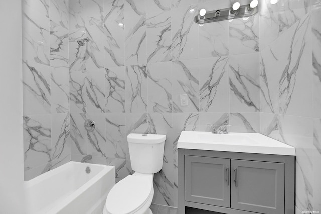 bathroom featuring vanity, toilet, and tile walls