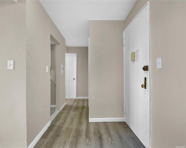 hallway featuring hardwood / wood-style flooring