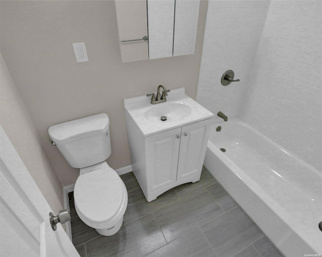 bathroom with tile patterned floors, vanity, and toilet