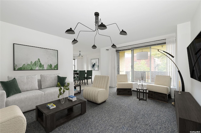 living room featuring carpet and a notable chandelier