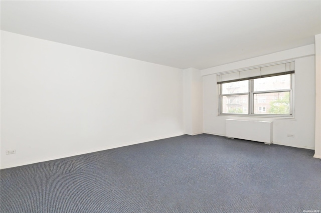 empty room featuring radiator heating unit