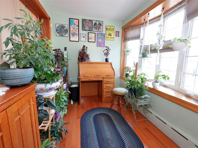 misc room featuring hardwood / wood-style floors and a baseboard radiator