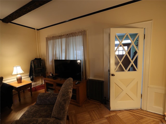 interior space featuring radiator, a baseboard heating unit, and parquet flooring