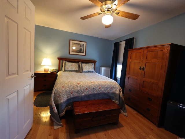 bedroom featuring ceiling fan and light hardwood / wood-style floors