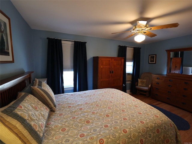 bedroom featuring ceiling fan and wood-type flooring