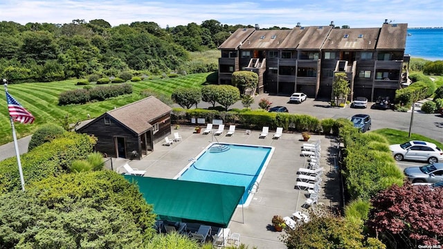 exterior space featuring a patio area and a water view