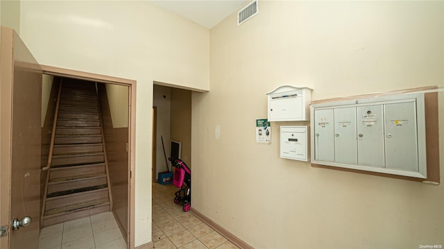 stairs featuring tile patterned flooring