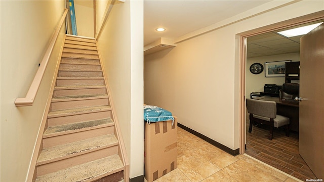 stairway featuring wood-type flooring