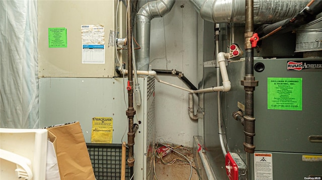 utility room featuring heating unit