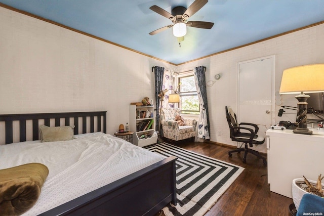 bedroom featuring dark hardwood / wood-style flooring, ceiling fan, and ornamental molding