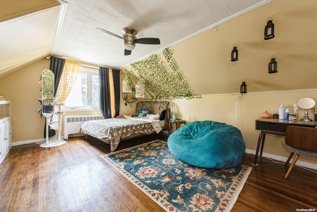 bedroom featuring radiator heating unit, vaulted ceiling, ceiling fan, and dark wood-type flooring