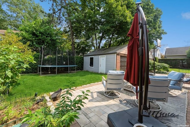 view of patio / terrace featuring an outdoor structure and a trampoline