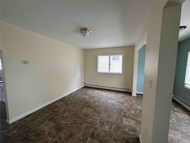 unfurnished room with a baseboard radiator