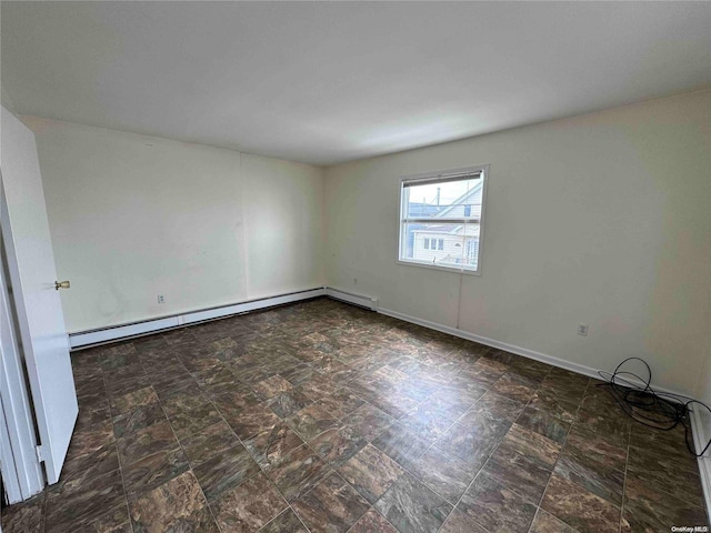 unfurnished room featuring a baseboard heating unit