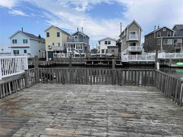 dock area with a deck with water view