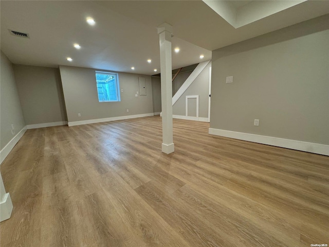 basement featuring light hardwood / wood-style floors