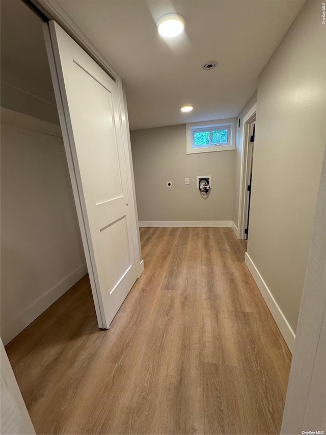 hall with light hardwood / wood-style flooring