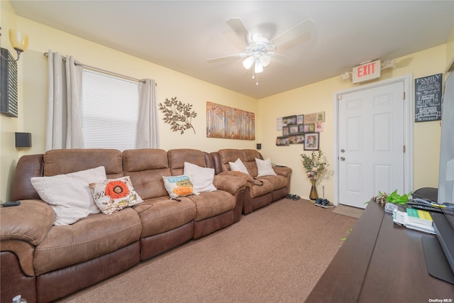 carpeted living room with ceiling fan