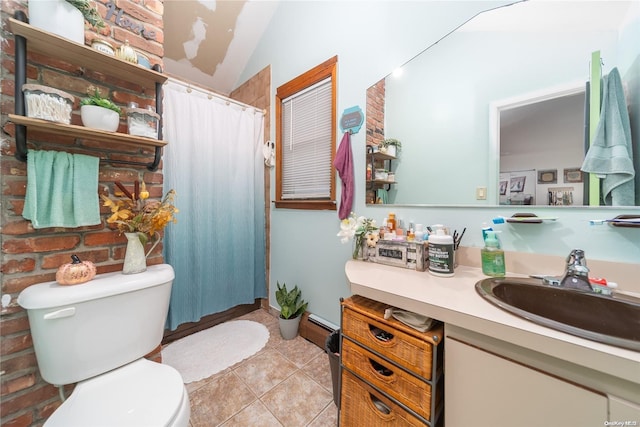 bathroom featuring a shower with curtain, tile patterned flooring, vaulted ceiling, toilet, and vanity