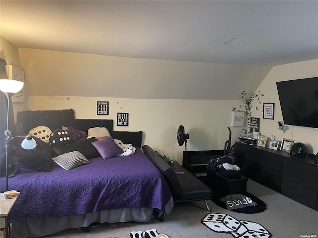 carpeted bedroom featuring vaulted ceiling