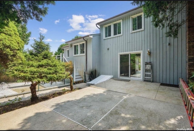 rear view of property featuring a patio area