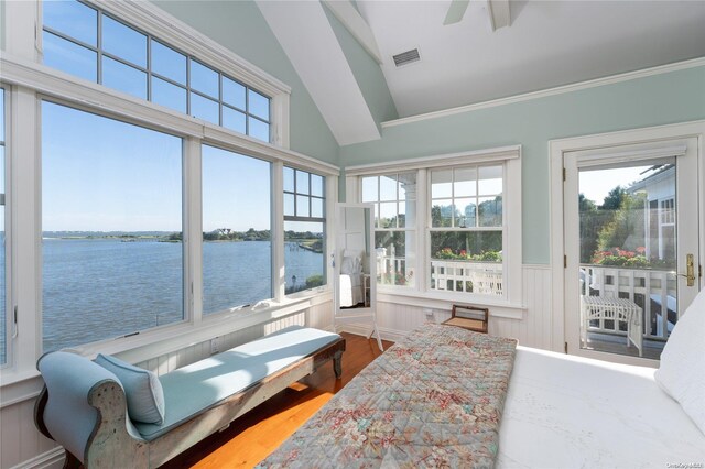 sunroom featuring ceiling fan, a water view, and lofted ceiling