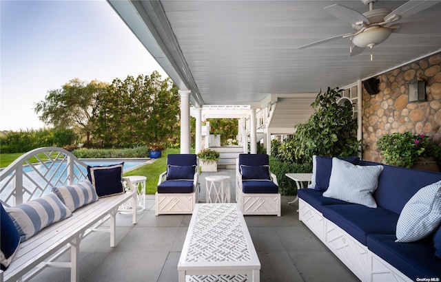 view of patio / terrace featuring an outdoor living space and ceiling fan