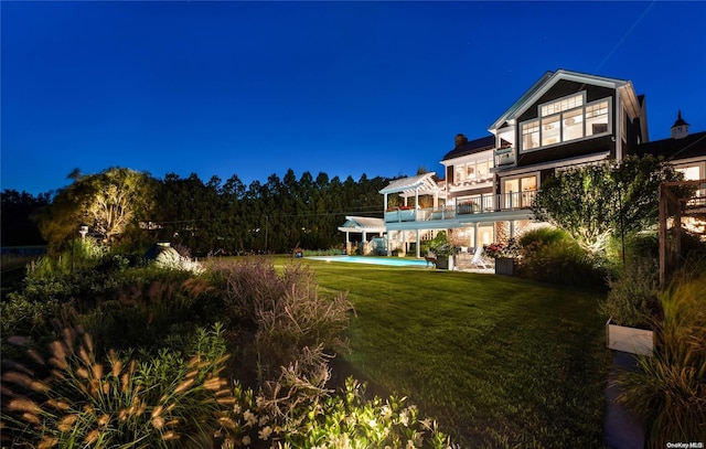 view of yard with a balcony