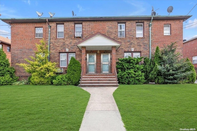 view of front of home with a front lawn