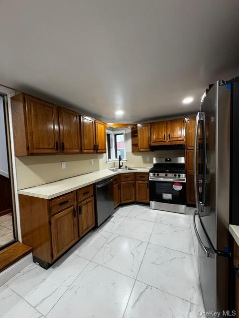 kitchen with appliances with stainless steel finishes and sink