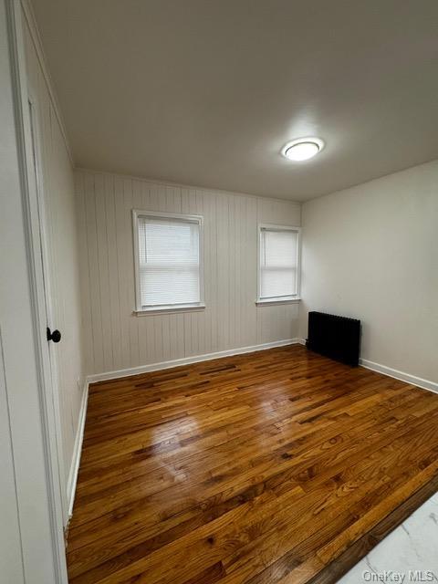 spare room featuring hardwood / wood-style flooring