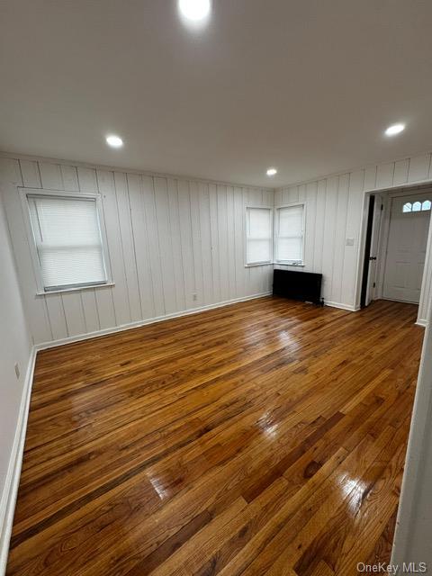 unfurnished living room featuring dark hardwood / wood-style floors