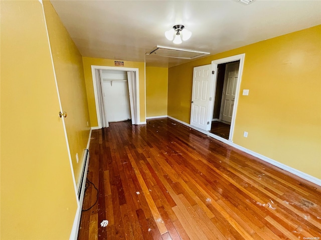 empty room with wood-type flooring