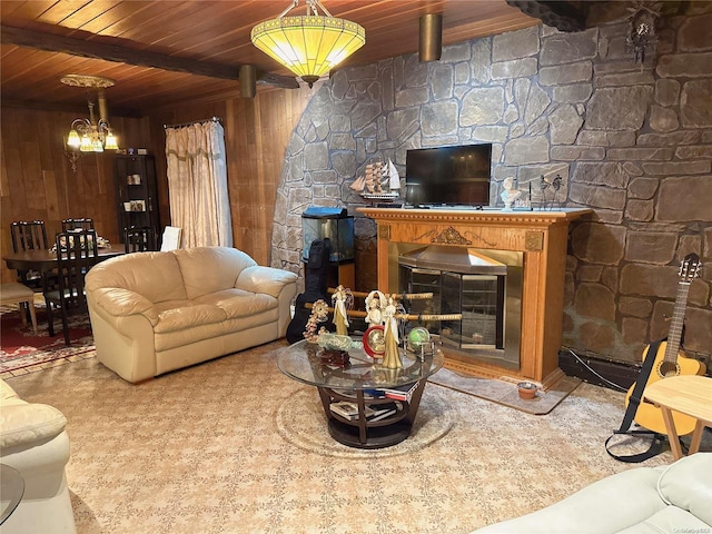 living room featuring a chandelier, wood walls, and wood ceiling