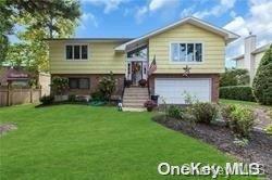 1 Smith St, Glen Head, NY 11545 - bi-level home with a garage