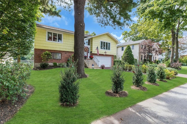 1 Smith St, Glen Head, NY 11545 - bi-level home with brick siding, a front lawn, and a garage